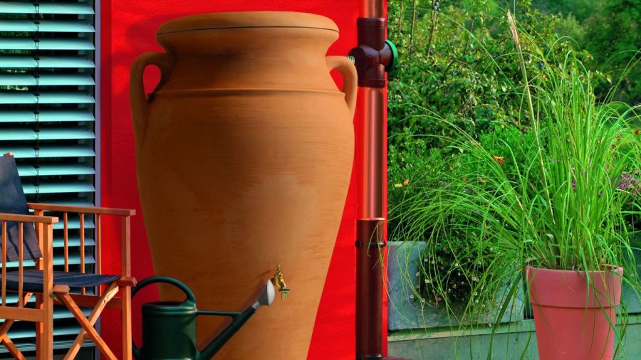 Helena Amphora 300 Litre Water Butt next to wall.